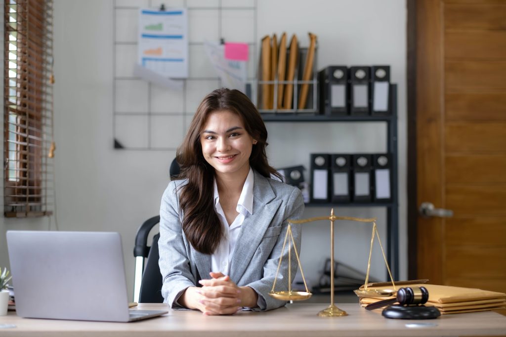 Asian lawyer woman working with a laptop computer in a law office. Legal and legal service concept.