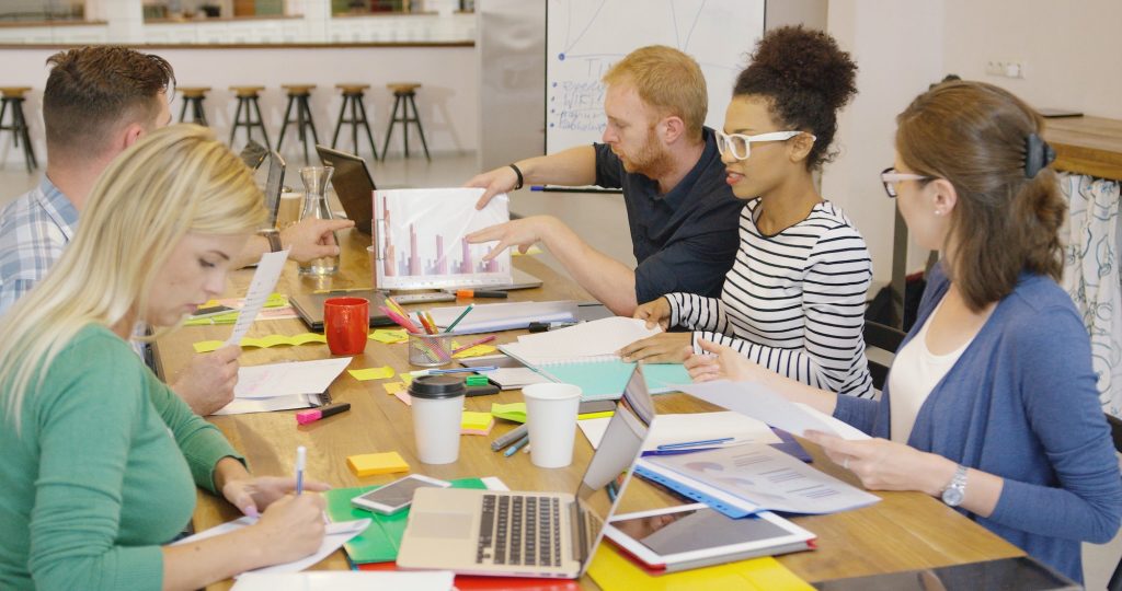 Group of people working at desktop