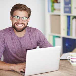 Portrait of man in front of the laptop